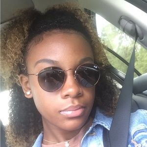 Brown Ray-bans with dark blue tinted lenses.